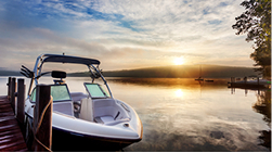 A boater navigating safely, illustrating experience as an insurance factor.