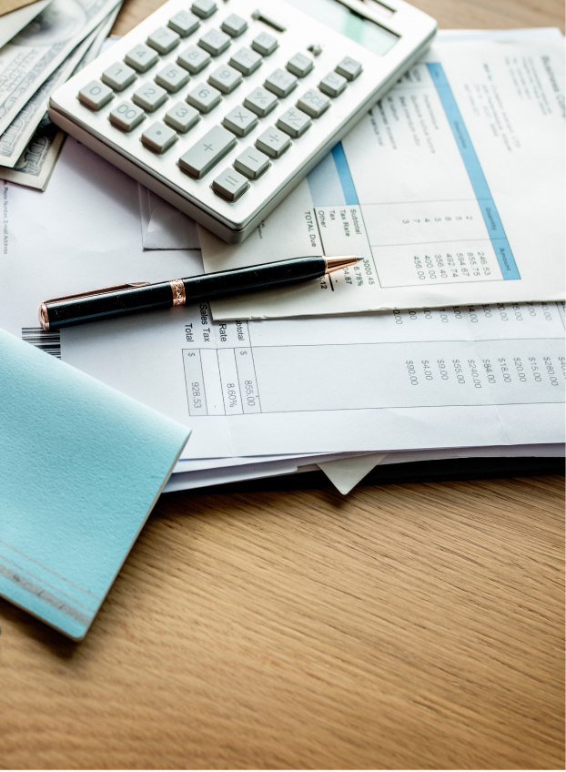 Money and a calculator, illustrating the cost of General Liability Insurance.